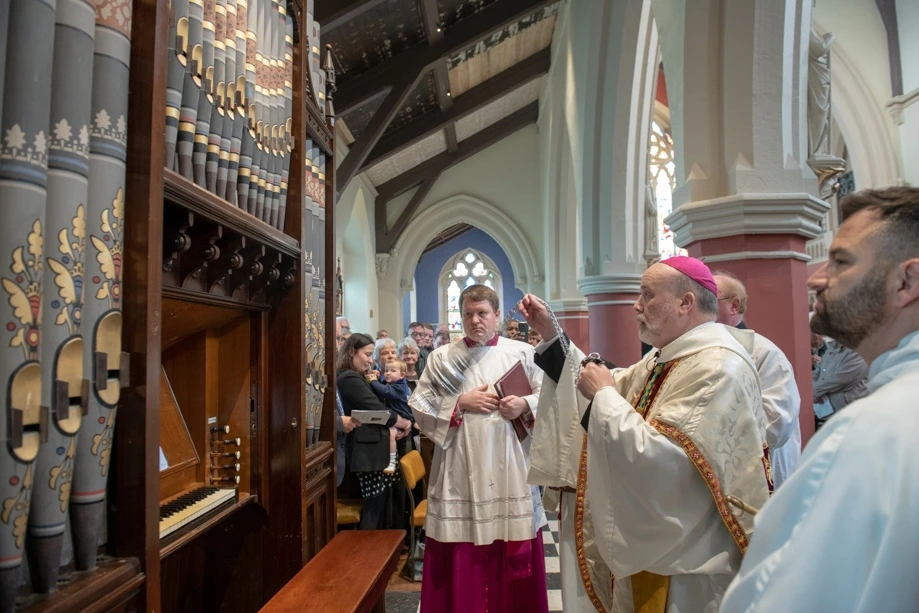 Bishop Macurs blessing the organ