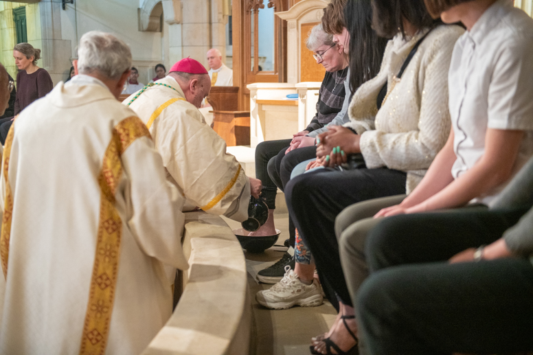 Bishop Marcus washed and dry the feet of 12 congregation members 