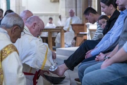 Bishop Marcus wash the feet of 12 members of the congregation